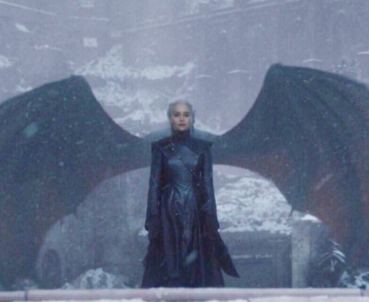Queen Dany with Drogon behind her making it appear as though she has dragon wings.